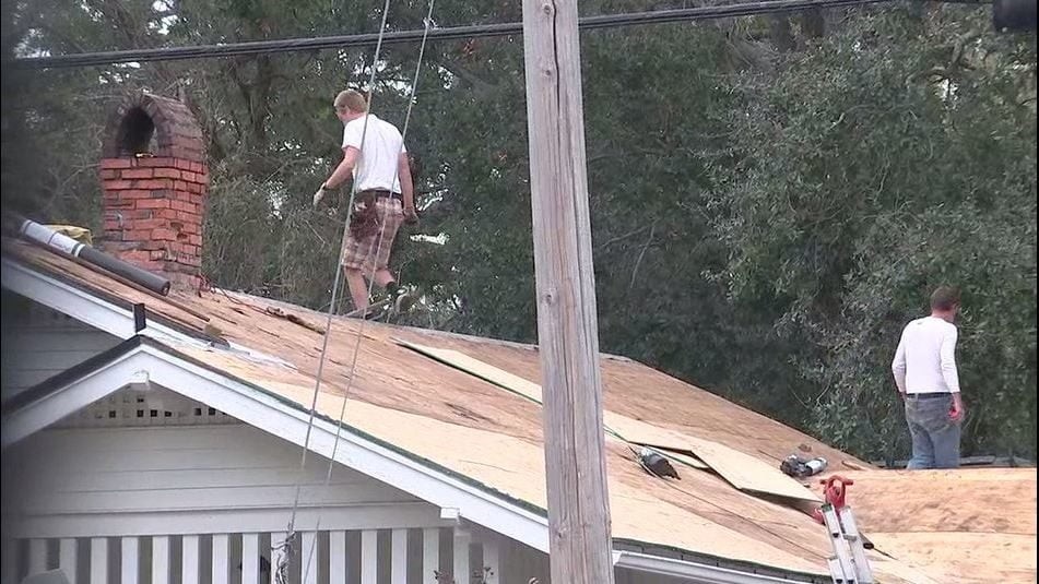 Woman sues roofing employer